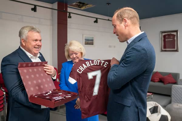Prince William was presented with Hearts football shirts for his children during a visit to the Edinburgh club to see how SAMH's 'The Changing Room' mental health project works in 2022 (Picture: Jane Barlow/WPA pool)