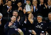 Finn Russell and Rory Darge of Scotland lift the Calcutta Cup after defeating England during the Guinness Six Nations 2024 match between Scotland and England at BT Murrayfield Stadium on February 24, 2024.
