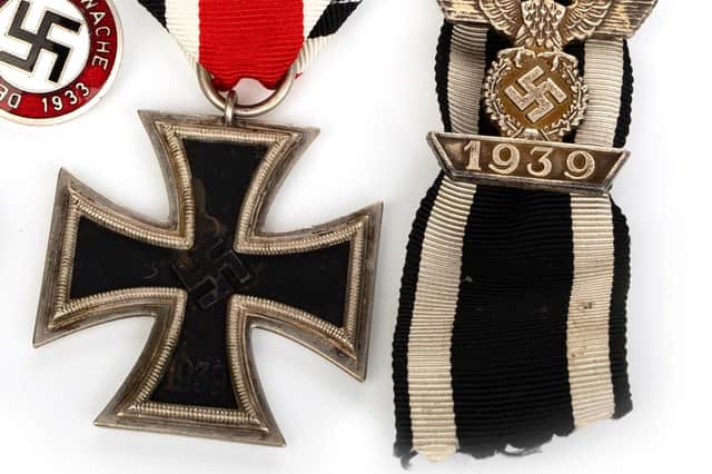 The Nazi medal and Swastika badge sold at auction