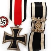 The Nazi medal and Swastika badge sold at auction