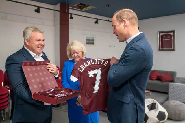 Prince William was presented with Hearts football shirts for his children during a visit to the Edinburgh club to see how SAMH's 'The Changing Room' mental health project works in 2022 (Picture: Jane Barlow/WPA pool)