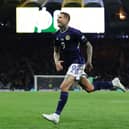 Lyndon Dykes celebrates scoring for Scotland at Hampden Park. Cr: Getty Images.