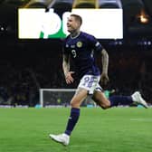 Lyndon Dykes celebrates scoring for Scotland at Hampden Park. Cr: Getty Images.