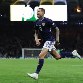 Lyndon Dykes celebrates scoring for Scotland at Hampden Park. Cr: Getty Images.