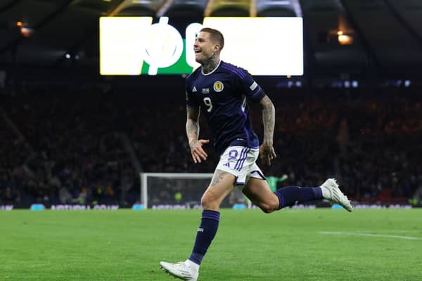 Lyndon Dykes celebrates scoring for Scotland at Hampden Park. Cr: Getty Images.