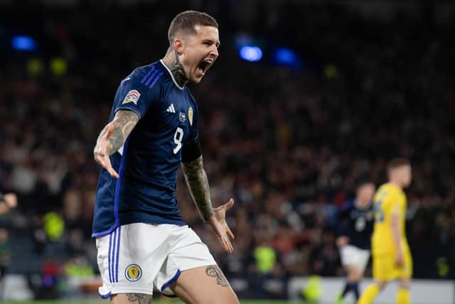 Lyndon Dykes scores for Scotland against Ukraine in 2022. Cr: SNS Group.