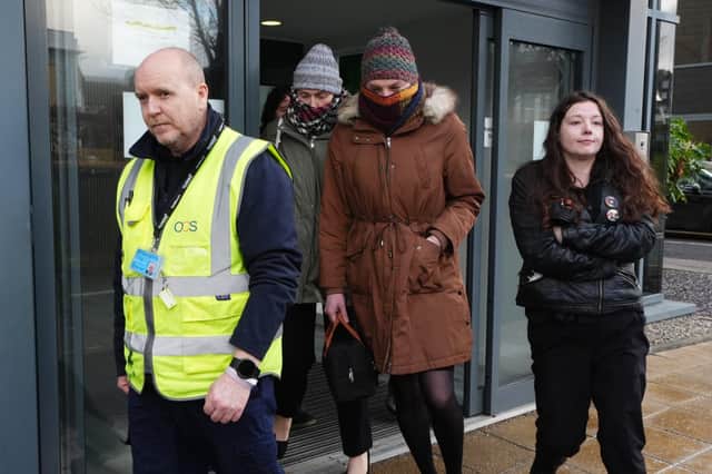 Dr Beth Upton (centre) leaves an employment tribunal in Dundee
