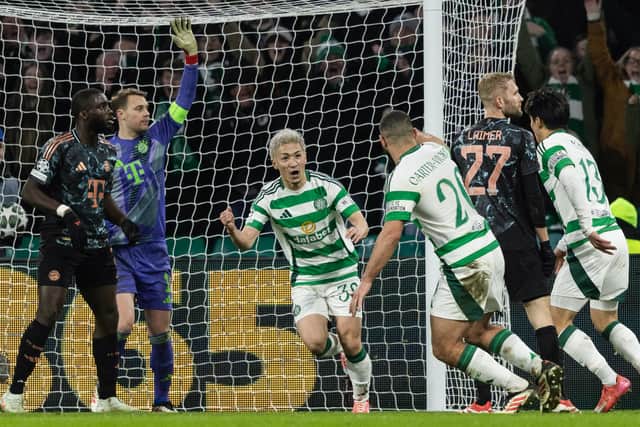 Celtic's Daizen Maeda (centre) celebrates pulling a goal back to make it 2-1 against Bayern Munich in the Champions League play-off first leg.  (Photo by Craig Foy / SNS Group)