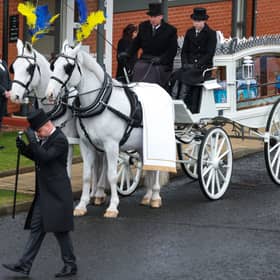 A horse-drawn carriage with the coffin of child murder victim Hope Gordon in Livingston (Picture: Jeff J Mitchell)