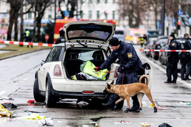 Emergency services attend the scene of an accident after a driver hit a group of people in Munich, Germany