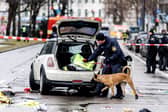 Emergency services attend the scene of an accident after a driver hit a group of people in Munich, Germany
