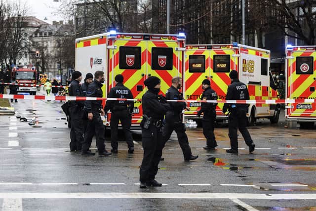 Emergency services attend the scene of an accident after a driver hit a group of people in Munich, Germany