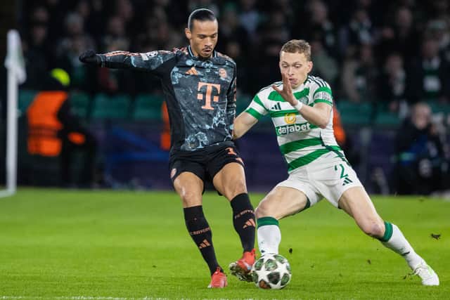 Alistair Johnston battles with Bayern Munich forward Leroy Sane.