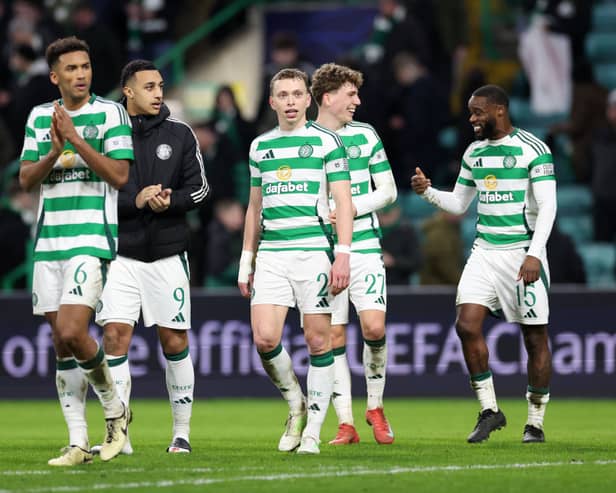 Celtic’s Alistair Johnston salutes the fans at full-time against Bayern Munich.