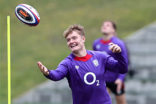 Fin Smith is all smiles during an England training session.
