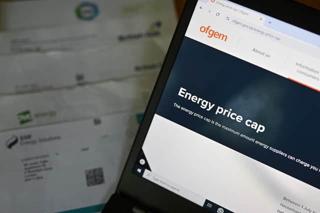 Regulator Ofgem is displayed on the screen of a laptop, next to energy bills. Picture: Justin Tallis/AFP via Getty Images