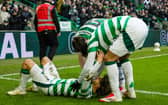 Jota is mobbed by his teammates after scoring against Dundee United.