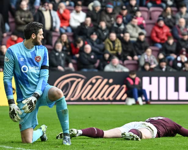 Hearts defender Jamie McCart looks dejected after scoring a second own goal to make it 3-1 to Rangers. (Photo by Rob Casey / SNS Group)
