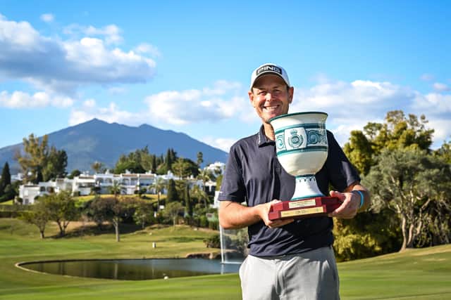 Englishman Simon Griffiths shows off the trophy after winning the Staysure Marbella Legends