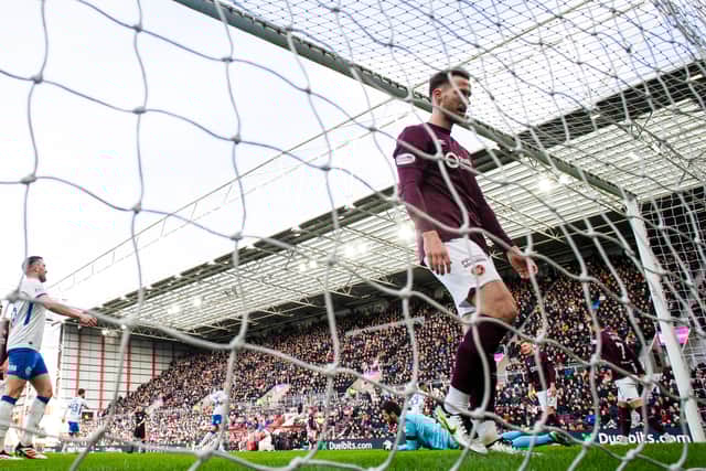 Hearts' Jamie McCart scores an own goal to make it 1-0 to Rangers. (Photo by Mark Scates / SNS Group)