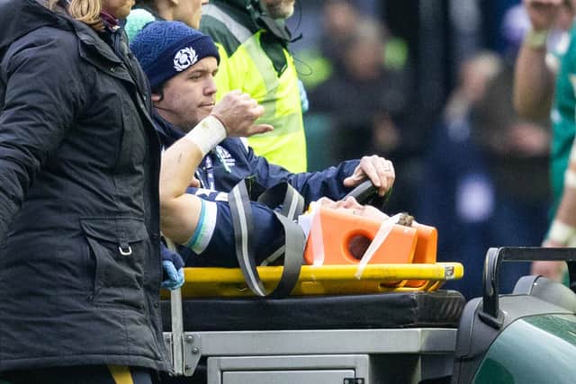 Scotland's Darcy Graham is taken off injured during the Guinness Six Nations match with Ireland.