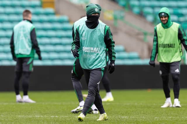 Daizen Maeda wraps up during a Celtic training session at Celtic Park ahead of the journey to Munich. (Photo by Craig Williamson / SNS Group)