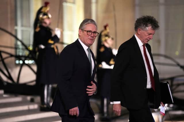 Sir Keir Starmer, left, leaves an informal meeting of leaders from key European Union nations and the United Kingdom, at the Elysee Palace in Paris