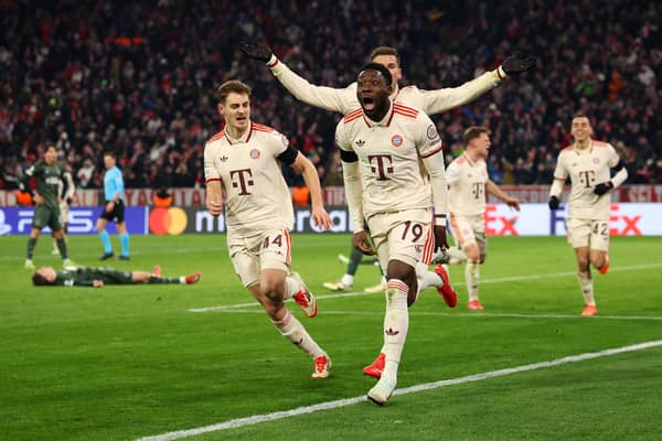 Alphonso Davies celebrates Bayern Munich's late goal.
