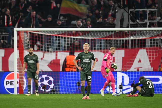 Daizen Maeda of Celtic looks dejected after Bayern Munich's late goal.