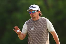 Ewen Ferguson acknowledges the crowd during the Hero Dubai Desert Classic at Emirates Golf Club last month