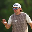 Ewen Ferguson acknowledges the crowd during the Hero Dubai Desert Classic at Emirates Golf Club last month