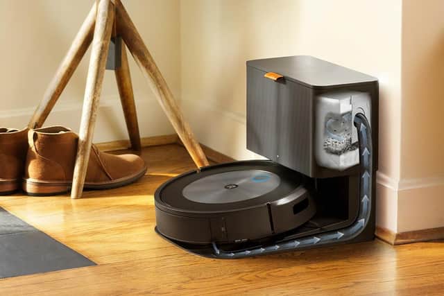 The base station empties the vacuum and charges the robot