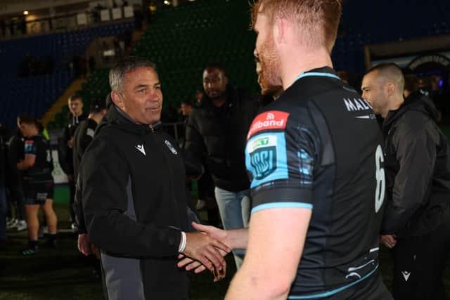 Glasgow Warriors head coach Franco Smith shakes hands with Gregor Brown.