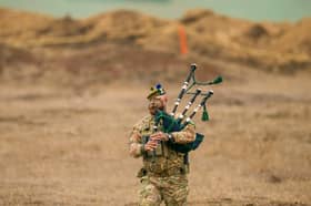 Lance Corporal Jamie Killorn plays the pipes during Nato's Steadfast Dart military exercise in Smardan, eastern Romania (Picture: Vadim Ghirda)