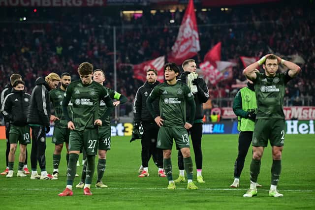 Celtic players react after the the 1-1 draw in Munich that ended their Champions League adventure. (Photo by TOBIAS SCHWARZ/AFP via Getty Images)