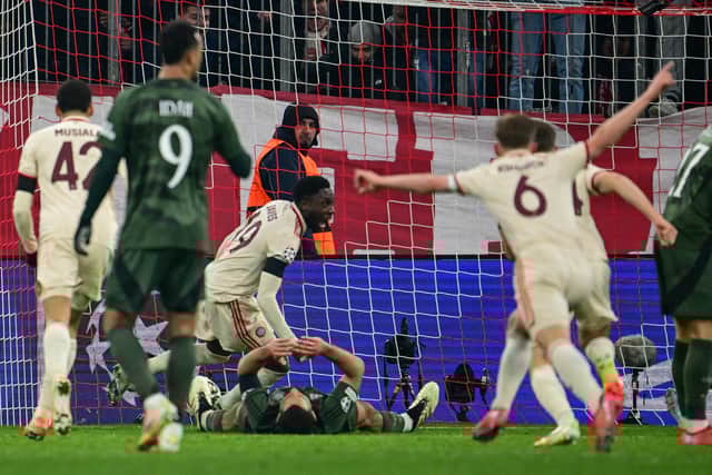Bayern Munich's Alphonso Davies scores in the last minute of injury-time to leave Celtic defender Cameron Carter-Vickers lying dejected on the turf. (Photo by TOBIAS SCHWARZ/AFP via Getty Images)