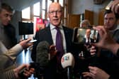 First Minister of Scotland John Swinney speaks to the media after First Minister's Questions at the Scottish Parliament