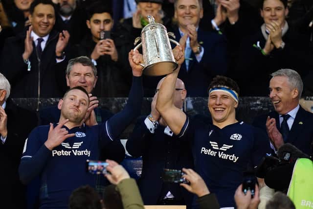 Co-captains Finn Russell and Rory Darge lift the Calcutta Cup after the win over England at Murrayfield in 2024.
