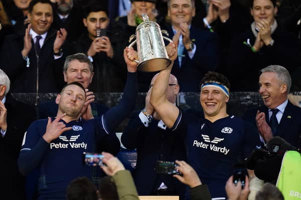 Co-captains Finn Russell and Rory Darge lift the Calcutta Cup after the win over England at Murrayfield in 2024.