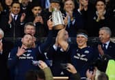 Co-captains Finn Russell and Rory Darge lift the Calcutta Cup after the win over England at Murrayfield in 2024.