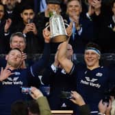 Co-captains Finn Russell and Rory Darge lift the Calcutta Cup after the win over England at Murrayfield in 2024.