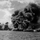The USS Arizona burns furiously in Pearl Harbor after Japan's surprise attack on December 7, 1941 (Picture: Hulton Archive)