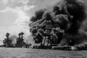 The USS Arizona burns furiously in Pearl Harbor after Japan's surprise attack on December 7, 1941 (Picture: Hulton Archive)
