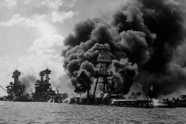 The USS Arizona burns furiously in Pearl Harbor after Japan's surprise attack on December 7, 1941 (Picture: Hulton Archive)