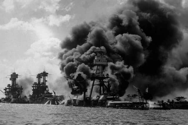 The USS Arizona burns furiously in Pearl Harbor after Japan's surprise attack on December 7, 1941 (Picture: Hulton Archive)
