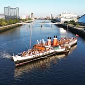 Waverley departing from its berth beside Glasgow Science Centre