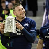 Scotland's Finn Russell poses with the Calcutta Cup after a fourth successive victory over England last year. (Photo by Ross Parker / SNS Group)
