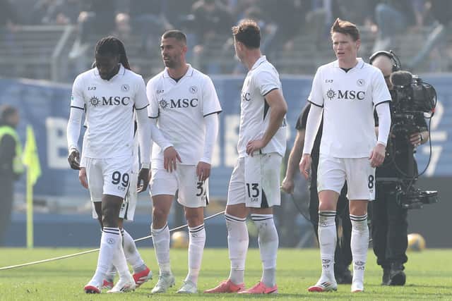 Scott McTominay and his Napoli teammates look on after defeat by Como.