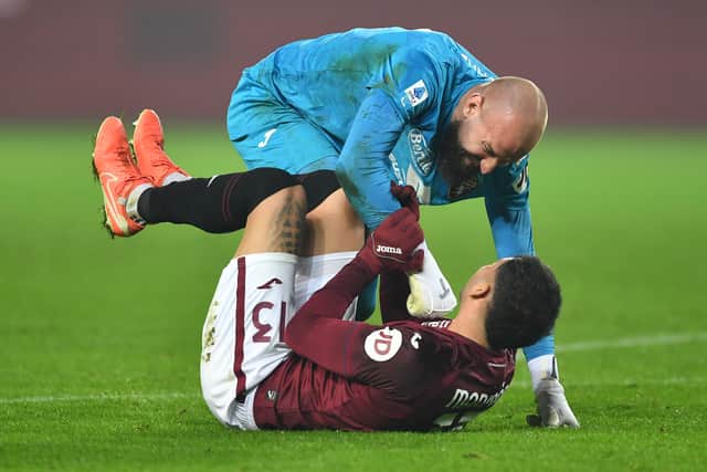 Torino goalkeeper Vanja Milinkovic-Savic celebrates the win over AC Milan with Guillermo Maripan.