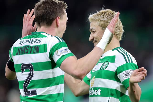 Alistair Johnston and Daizen Maeda celebrate the Celtic win over Aberdeen.